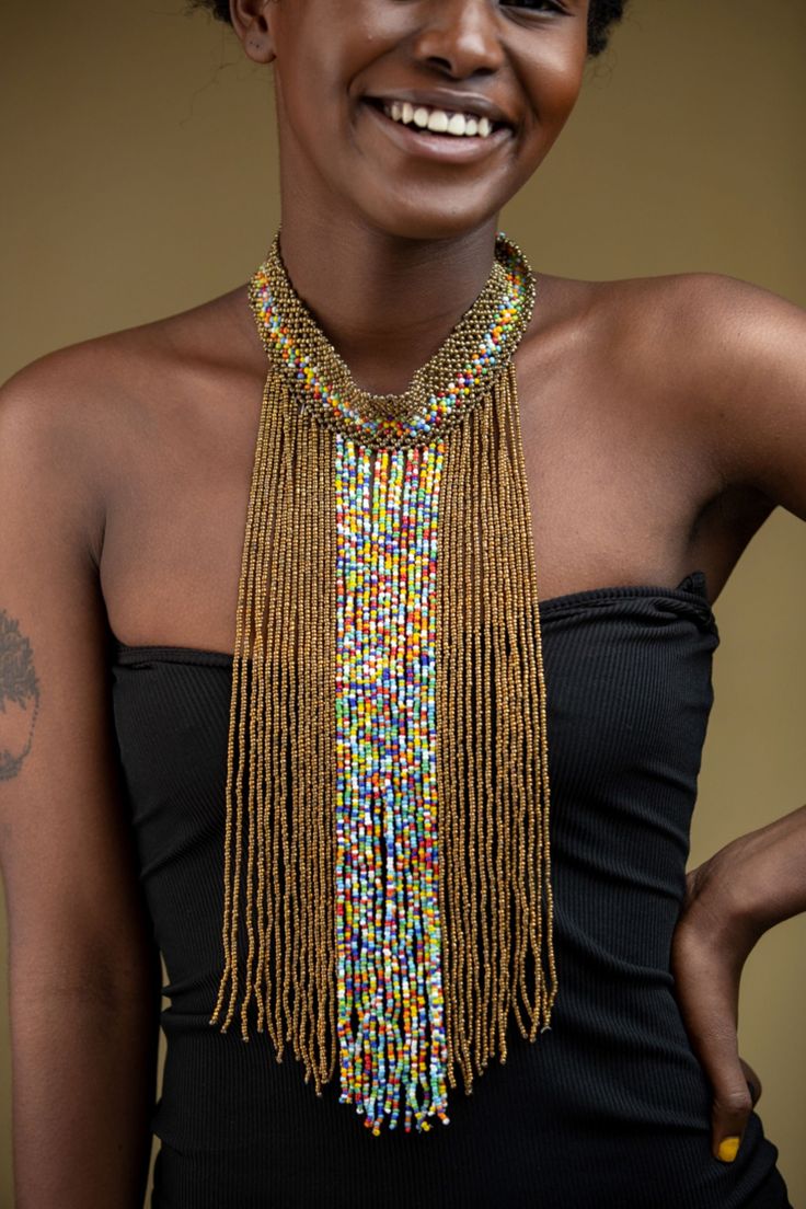 Unique African Maasai Handcrafted Beaded Necklace with an Elegant Look and Brilliant Finish. Color - Copper and Mixed Color Beads. Size - Adjustable Width. Length (Downwards) - 13.5 Inches / 35 cm. **GET FREE SHIPPING FOR ADDITIONAL ITEMS PURCHASED. Yes, Buy Multiple Items and pay shipping for 1 item only- The rest ships Free. (No Limits on the number of Multiple items). With a faster delivery time of 3 days via DHLExpress, Worldwide. Ordinary/Standard Shipping also available upon request. We Cu Adjustable Beaded Chain Necklaces For Festive Occasions, Adjustable Beaded Necklaces For Festive Occasions, Traditional Multicolor Jewelry With Gold Beads, Multicolor Multi-strand Beaded Necklaces With Gold Beads, Unique Gold Beaded Choker, Traditional Colorful Beads Bib Necklace For Party, Bohemian Multicolor Polished Beads Choker, Traditional Bib Necklace With Colorful Beads For Parties, Bohemian Beaded Chain Beads For Festive Occasions