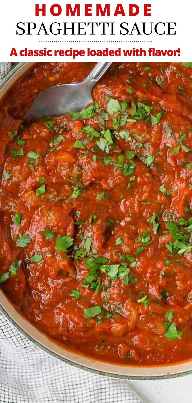 homemade spaghetti sauce in a pan with a spoon