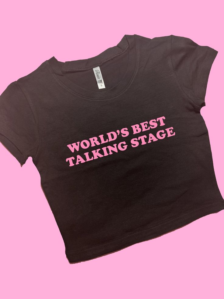 World's Best Talking Stage SNUG FIT Crop Top | Cute Crop Top | Graphic Top | Gift For Her | Y2K Baby Tee | Gift For Girlfriend  Y2K Crop Top Comfy Top to Lounge in! Actual item may be lighter/darker than pictured. M A T E R I A L S - SNUG FIT - 100% RING SPUN COTTON - Shoulder Taping S I Z I N G - Size chart is available on our listing photos. S H I P P I N G  &  P R O D U C T I O N  T I M E - Production Time is 5 Business Days. (May be delayed during the Holiday Season) - Shipping Time is 2-6 B Sassy Graphic Tees, Graphic Crop Tops, Funny Crop Tops, Graphic Tees Funny, Y2k Graphic Tees, Etsy Clothes, Silly Shirt, Funky Shirts, Cropped Graphic Tees