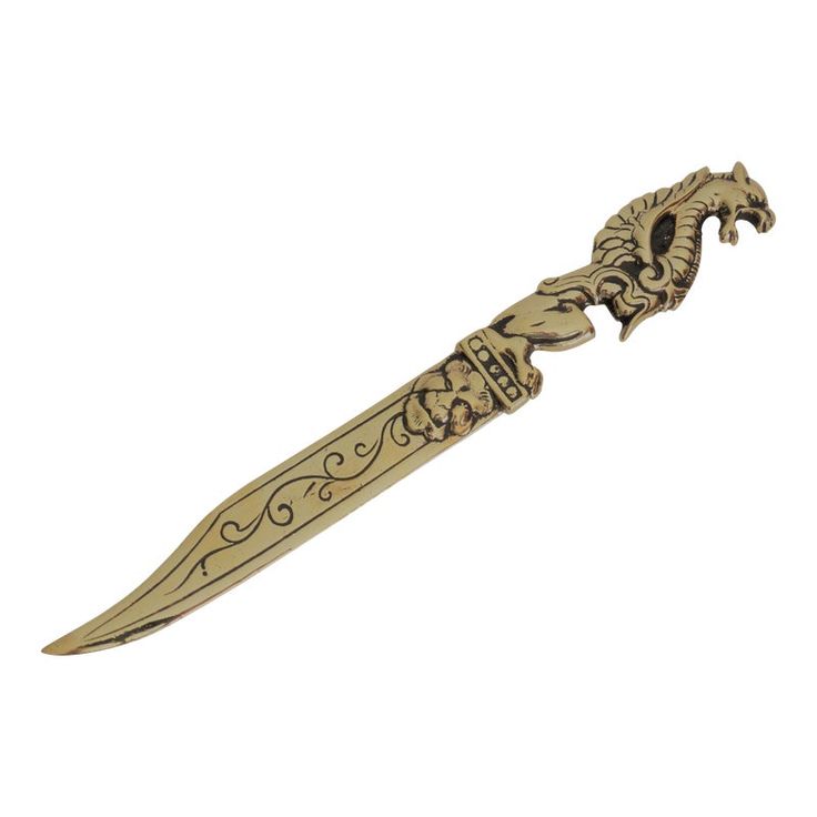 a gold colored knife with an intricate design on it