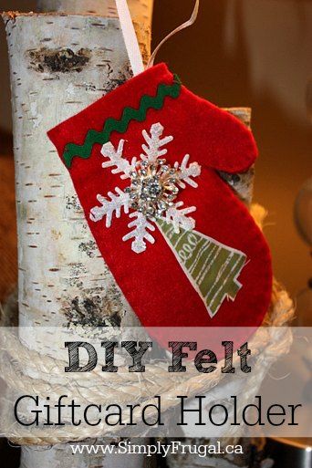 a christmas stocking hanging from a tree with the words diy felt gift card holder