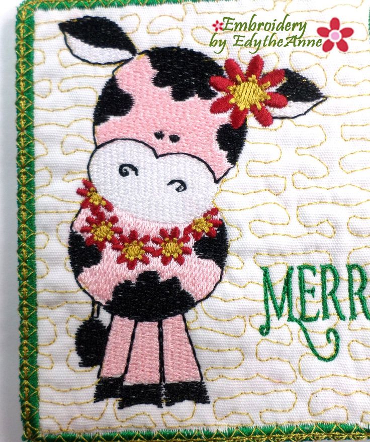 a close up of a patch with a cow on it's face and the words merry written in green