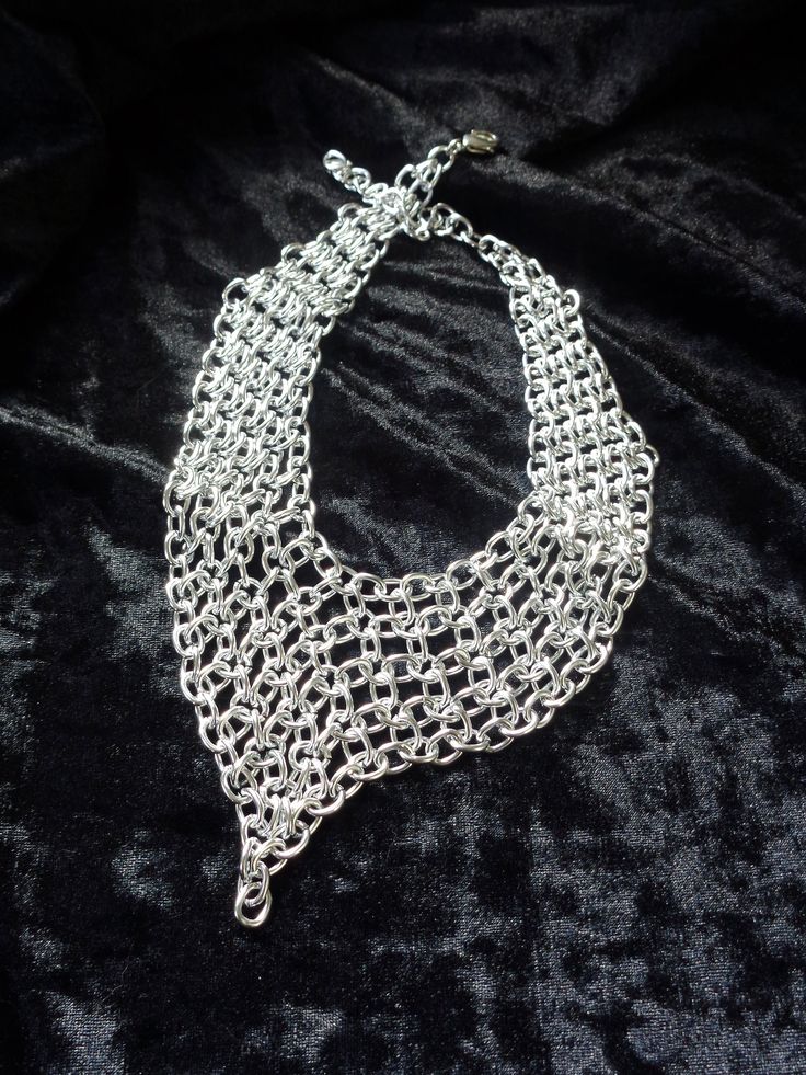 "This aluminum chainmail necklace is quite a chameleon. The length is adjustable so you can change this piece from an edgy choker to an elegant short necklace by re-positioning the clasp. The first 2 photos illustrate the transformation from a 14\" long choker (photo 1) to a 17\" long necklace (photo 2). You'll have to select your color and the necklace length (measured along the top of the necklace, including the clasp). The extension chain will be 3\". If you want it longer or shorter leave me Unique Metal Choker With Adjustable Chain, Unique Metal Choker For Party, Metal Chainmail Necklace For Party, Unique Metal Choker Chain Necklace, Party Chainmail Metal Necklace, Unique Metal Chain Choker, Unique Metal Chain Necklace For Party, Metal Chainmail Choker As A Gift, Silver Chainmail Choker As A Gift