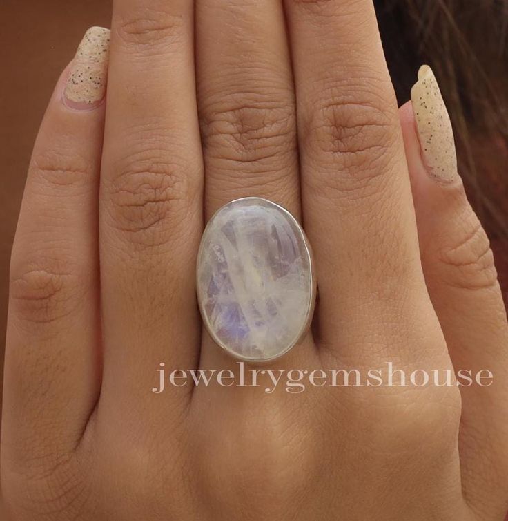 Rainbow Moonstone Ring, 925 Sterling Silver Ring, Healing crystal Ring, Halloween Jewelry, Handmade Silver Ring, Birthday Gift For Sister. Gemstone Name - Rainbow Moonstone . Stone Quality - AAA  Ring Weight - 8.77 gm  Ring Length -2.6 cm Ring Width - 1.8 cm Stone Shape - As shown in the picture. Ring Size - All Ring Size Available.  We serve complete 925 sterling silver Jewelry and genuine properties of the stone.  The products are dispatched from the small business from UK. Product Quality and Packaging - Our all products are 925 Silver Stamped which shows that the product is genuine and authentic .The products are dispatched from the small business from UK so you get the product on time and the product packaging comes in bubble foil wrap with all the precautions taken primarily that you Magical Sterling Silver Crystal Ring For Gift, Handmade Magical Silver Crystal Ring, Moon-shaped Sterling Silver Moonstone Ring As Gift, Mystical Sterling Silver Crystal Ring, Unique Moonstone Crystal Ring With Round Shape, Unique Moonstone Crystal Ring, Mystical Round Moonstone Ring As Gift, Mystical Round Moonstone Ring Gift, Handmade Magical Moonstone Ring In Sterling Silver