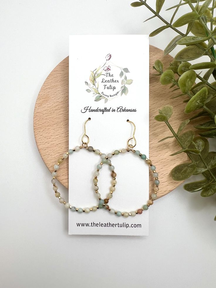 These beaded hoop earrings showcase a beautiful assortment of stone beads, each one adding its unique shade.  Perfect for adding a touch of bohemian flair to any outfit, these lightweight earrings are both stylish and comfortable, ideal for daily wear. Ear wires are gold plated stainless steel. DROP LENGTH:  Just under 2.5" WIDTH:  1.50" Thank you for Shopping The Leather Tulip.  I appreciate your support! https://instagram.com/theleathertulipboutique Earrings Bohemian, Lightweight Earrings, Beaded Hoop Earrings, Bohemian Earrings, Beaded Hoops, Light Weight Earrings, Jewelry Earrings Hoops, Ear Wires, Stone Beads