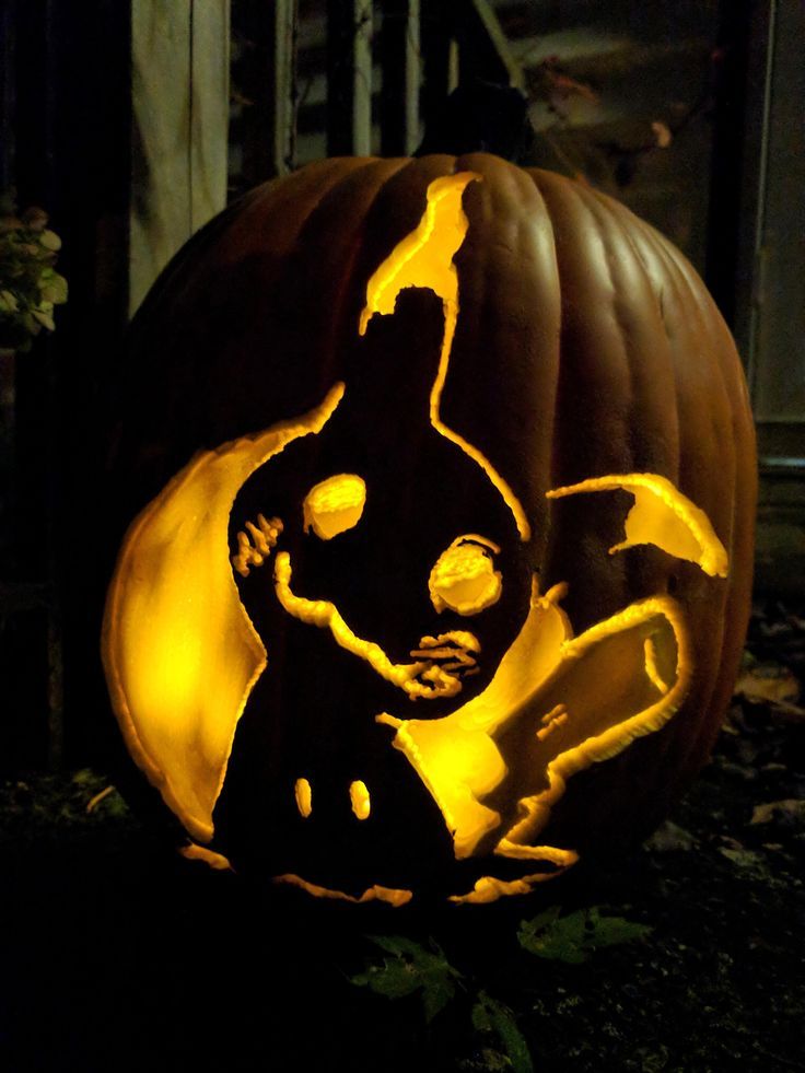 a pumpkin carved to look like a cartoon character