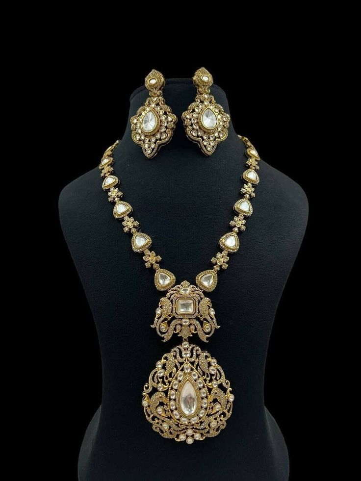 Dazzling kundan Polki stones with crystal-work teamed with a delicate gold frame instantly elevate any outfit. Best gift for your anniversary. Best gift for her Birthday. Necklace : 1 Earrings: 1 Pair Gold Kundan Necklace With Stone Work For Festivals, Gold Kundan Tikka With Intricate Design, White 22k Gold Kundan Necklace With Intricate Design, Ceremonial Gold Kundan Necklace With Stone Work, Ceremonial Gold Kundan Necklace Hand Set, Gold Bridal Necklace With Stone Work For Festive Occasions, Gold Sets With Intricate Design For Reception, Temple Style Kundan Necklace For Reception, Gold Kundan Chandbali Necklace With Stone Work