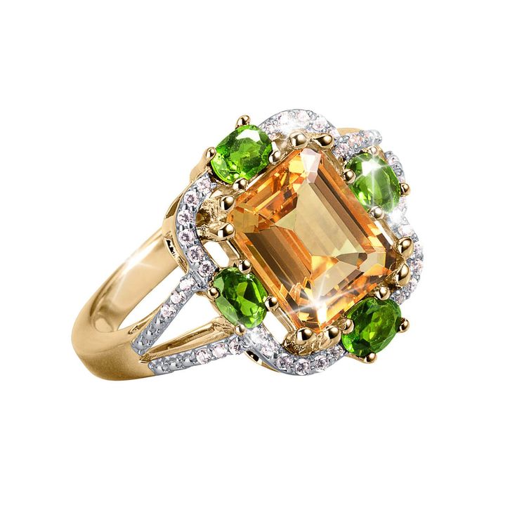 This gorgeous ring uses only the finest large carat weight Citrine, the sunny golden yellow colored gem. This magnificent stone weighs just under 2.5 carats and is set into the finest sterling silver plated in the warmth of 18k yellow gold. Bordered around the edge are 4 vivid jungle green chrome diopside stones. With our signature Diamondeau®, the supreme diamond alternative intricately set in-between and flowing down the split shoulder design, adding the final touches of shimmering delight. Green Citrine Rings With Accent Stones, Golden Yellow Color, Green Chrome, Citrine Jewelry, Gorgeous Ring, Jungle Green, Diamond Alternatives, Ladies Ring, Sparkle Jewelry