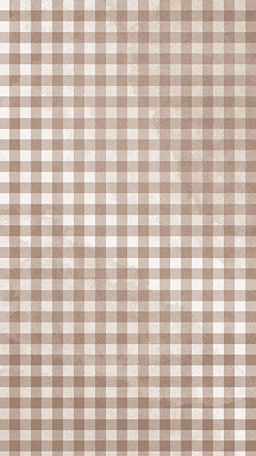 a brown and white checkered pattern is shown on the wall in this image, it appears to be grungy