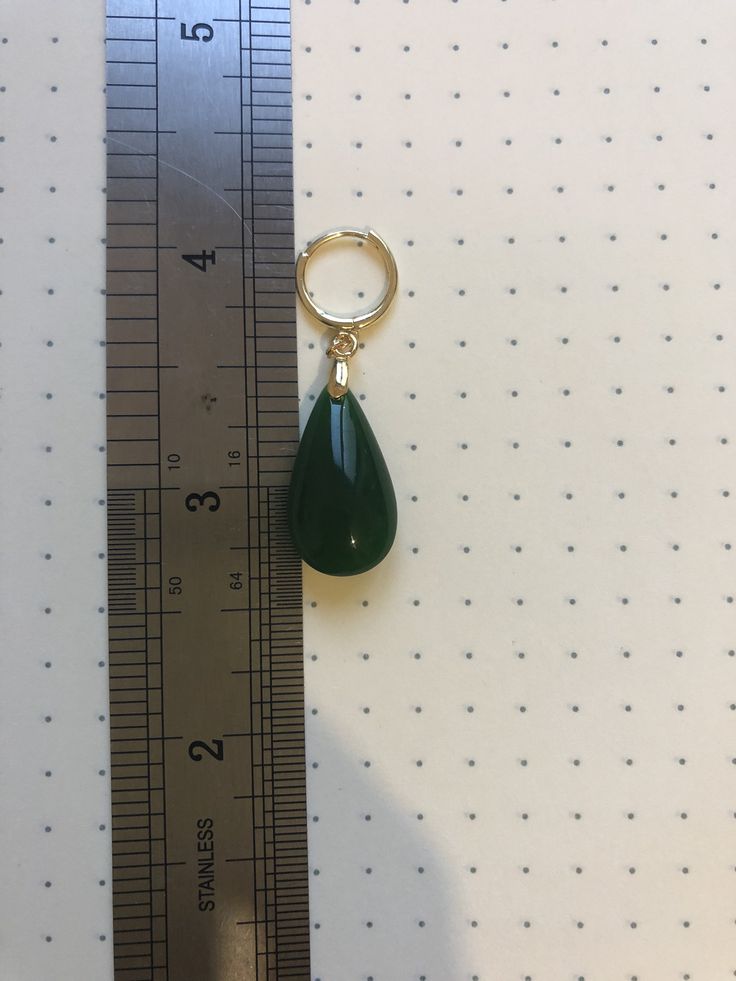 A pair of vintage dark green jade earrings. The teardrop-shaped earrings are made from quality natural green jade and 925 sterling silver hooks plated with 18K Gold. The delicate emerald-like green jade drops are natural, comes with modern gold hooks. It's truly a great combination of modern minimalistic design and ancient Chinese royalty taste. Some highlights of this elegant and charming dangle silver jade earrings are: *High-quality materials Made with high quality real green jade, 925 sterli Green Teardrop Clip-on Earrings For Gift, Vintage Green Jade Earrings, Single Green Long Drop Earring, Green Single Long Drop Earring, Nickel-free Green Teardrop Pendant Earrings, Green Clip-on Dangle Jewelry, Green Clip-on Dangle Earrings, Chinese Royalty, Mother Photos