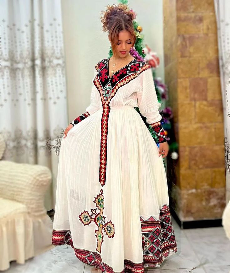 Radiant Red and Black Habesha Dress: Transitional Multicolor Maxi Dress, Multicolor Long Sleeve Dresses For Traditional Ceremonies, Multicolor Traditional Maxi Dress For Eid, Multicolor Maxi Dress For Traditional Ceremonies At Eid, Multicolor Maxi Dress For Traditional Ceremonies During Eid, Eid Multicolor Maxi Dress With Traditional Patterns, Multicolor Maxi Dress With Traditional Patterns For Eid, Fitted Bohemian Gown For Transitional Seasons, Multicolor Festive Dress For Navratri