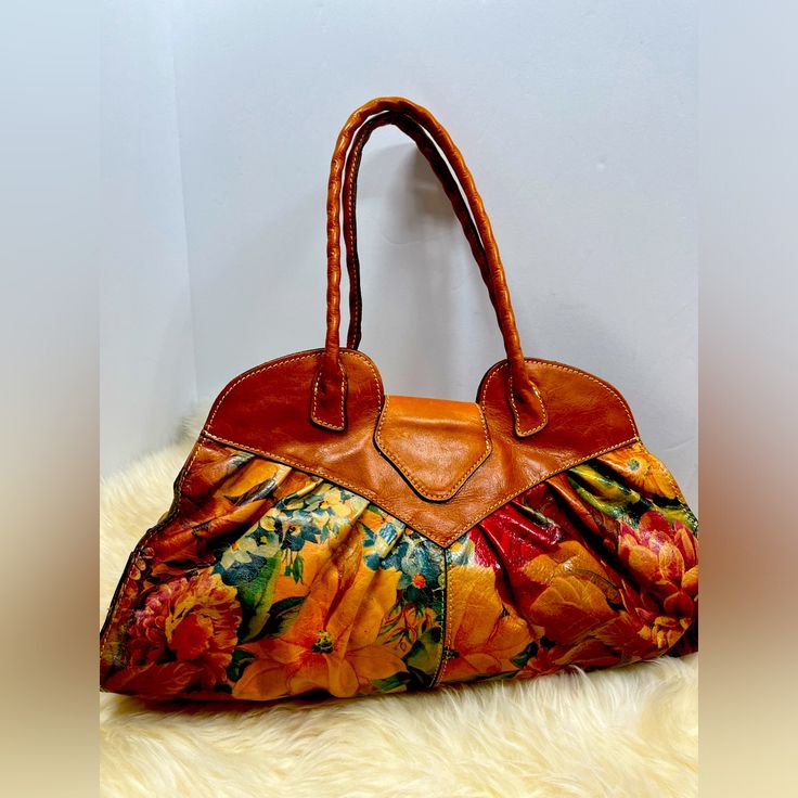 Patricia Nash Genuine Leather Fall Florals Vintage Victorian Garden Shoulder Bag Marcellara / Pn Signature Velour Lining / Inside Has Large Zip Pocket And Two Elastic Pockets. Snap Top Closure. Beautiful Bag In Excellent Condition. Please See All Photos And Video Before Purchasing Or Bidding For Sizes And Call Outs If Noted. Bohemian Multicolor Leather Satchel, Leather Top Handle Bag With Floral Print, Designer Leather Bag With Floral Print, Designer Multicolor Leather Shoulder Bag, Luxury Multicolor Floral Print Bags, Designer Multicolor Floral Print Bags, Leather Bags With Floral Print For Shopping, Multicolor Leather Bag With Leather Lining, Summer Leather Satchel For Daily Use