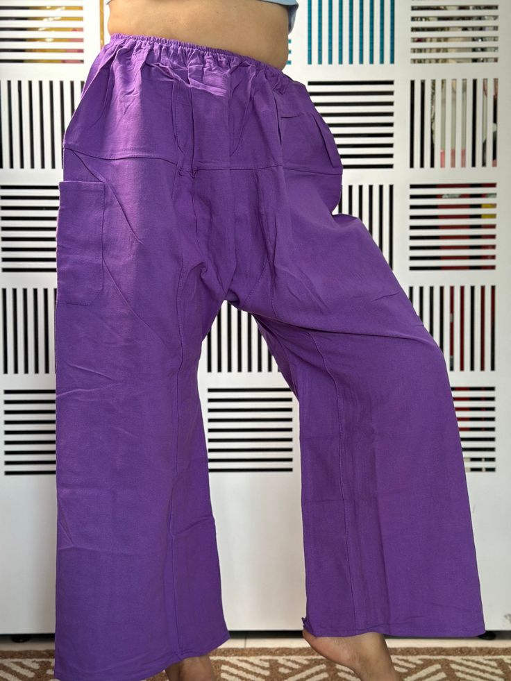 "Unisex Thai fisherman pants. One size fits all. You can wear in many occasions, casual wear, yoga wear, maternity wear, relax at home, travel etc.   If you are looking for some pants that you can wear everywhere, comfortable, relax and Easy to wear. Thai fisherman pants is Answer!! Nice gift for yourself or your lover    One pocket on the side for storing your items such as wallets, mobile phones, etc   Approx. Measurements: One size can fits most and 1 Pockets Measurement Waist 18-50\" hip 54\" Length 35\" Inseam 20\"   Ankle 25\" - Condition: Brand new without tags. 100% Cotton - Made in Thailand Shipping & Handling * Parcels will be ship via DHL Express" Baggy Cotton Cargo Pants In Purple, Baggy Purple Cotton Cargo Pants, Baggy Purple Cotton Pants, Purple Baggy Cotton Pants, Purple Cotton Pants With Pockets, Purple Cotton Bottoms With Side Pockets, Cotton Parachute Pants With Elastic Waistband For Yoga, Full-length Cotton Harem Pants With Pockets, Purple Cotton Wide Leg Pants With Pockets