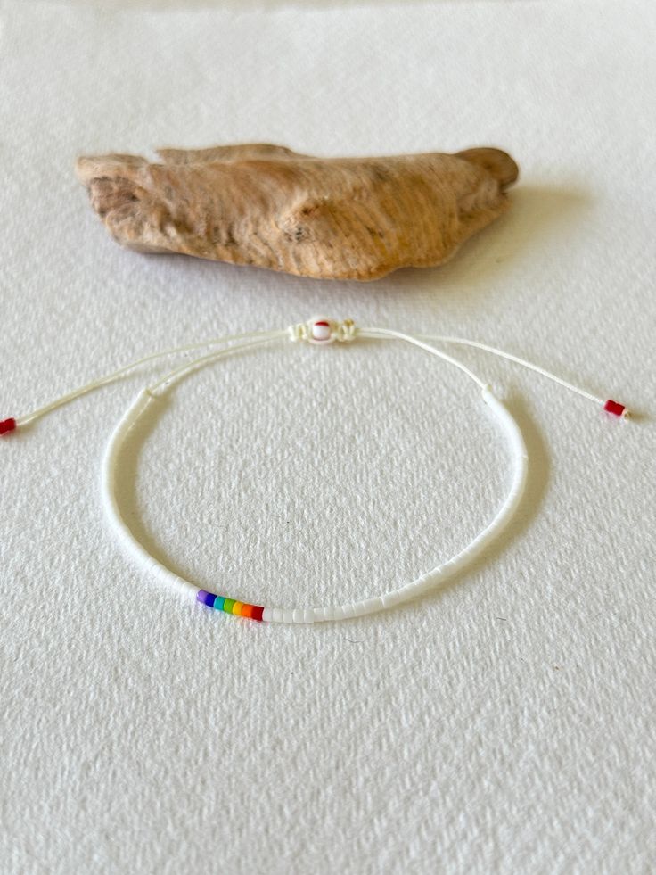 - Celebrate Pride with style with our Special Edition Rainbow Beaded Necklace! This exquisite piece features a vibrant, slightly off-centered rainbow sequence set among luminous white beads, symbolizing both uniqueness and unity. 🌈 🌈 Adjustable Design: Fits comfortably for all, perfect for everyday wear or special occasions. 🌈 High-Quality Materials: Crafted with durable, skin-friendly beads. 🌈 Unique Gift Idea: Ideal for showing support or as a gift to uplift someone's spirit. 🌈 Versatile Adjustable Rainbow Friendship Bracelets With Letter Beads, Adjustable Rainbow Bracelets With Letter Beads, Rainbow Friendship Bracelets With Round Beads, Adjustable Rainbow Friendship Bracelets With Round Beads, Adjustable Rainbow Bracelets For Festivals, Adjustable Rainbow Braided Beaded Bracelet, Adjustable Rainbow Beaded Friendship Bracelets, Adjustable Beaded Rainbow Friendship Bracelets, Handmade Adjustable Rainbow Beaded Bracelets