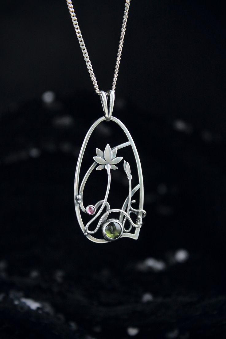 ITEM DESCRIPTION: The size H 4 cm x W 3 cm (1 3/4 x 1 inch). Weight - 6g. You can buy it with the chain or without. The most delicate flower of the lotus can make someone very happy. I made this botanical jewelry of sterling silver, peridot, and rhodolite garnet. This is a true work of art. It will emphasize your exquisite taste and status, and will also bring a lot of compliments. Ooak jewelry made by eco-friendly materials. The parcel will be sent during 1-2 days after payment. Delivery usuall Nature-inspired Pendant Necklace As Gift For Her, Spiritual Birth Flower Pendant Jewelry, Nature-inspired Jewelry With Large Pendant For Healing, Nature-inspired Healing Jewelry With Large Pendant, Nature-inspired Flower Gemstone Jewelry, Nature-inspired Green Jewelry With Birth Flower, Botanical Sterling Silver Jewelry Gift, Healing Jewelry With Large Pendant, Healing Large Pendant Jewelry