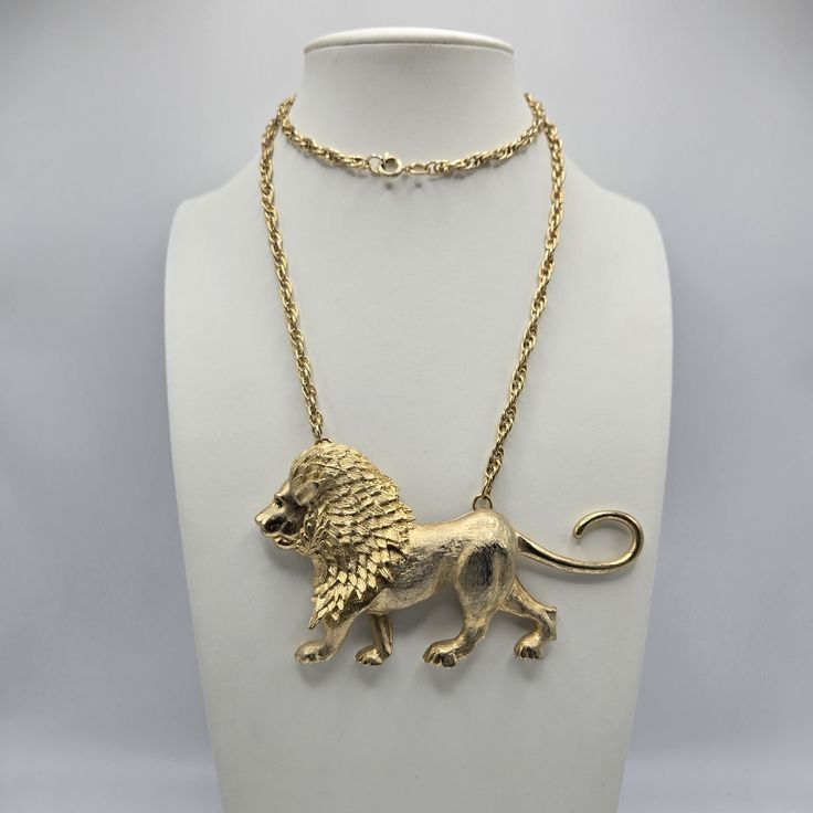 Park Lane Lion Goldtone Pendant Necklace Animal Mogul Leo Austrology Vintage Vtg. Park Lane Vintage Walking Lion Pendant Necklace. Chain Measures Approximately 26" With A Spring Ring Clasp While The Lion Measures Approximately 4" Long And 2.5" Tall. Brushed, Textured Gold Tone. Lion Features A Green Rhinestone Eye. Marked 'Park Lane' On Backside Of Pendant. Walking Lion, Lion Pendant, Park Lane Jewelry, Park Lane, Gold Texture, The Lion, Necklace Chain, Spring Rings, Womens Jewelry Necklace