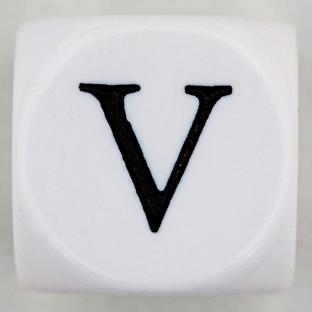 the letter v is made out of white ceramic