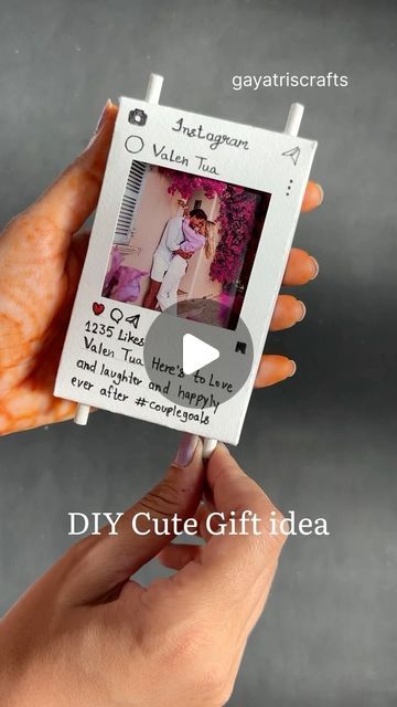 a person holding up a photo frame with the words diy cute gift idea