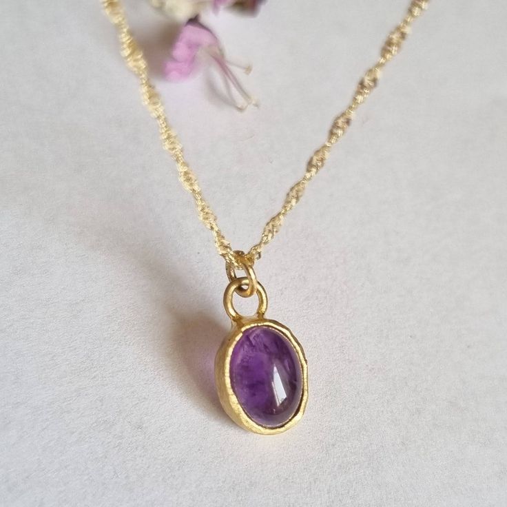 "Beautiful oval amethyst boho pendant necklace, minimalist jewelry for women, available in 14k gold plating, sterling silver, and 9k or 14k solid yellow gold. This regal necklace is solid gold and has an oval solid gold pendant. The pendant is set with an oval amethyst with a deep purple color. It is available in a high-quality 14k gold plating pendant with a gold-filled necklace, sterling silver, and 9k or 14k solid yellow gold, and in 16\" and 18\" lengths.  This necklace makes a great birthday gift for women born in February, as amethyst is the month's birthstone. This necklace is simply breathtaking. It is delicate and romantic yet striking and meaningful. You can wear it as a single item or layered with other necklaces for a total boho-chic look. It will accompany you for many years t Minimalist Oval Pendant Necklace As Gift For Her, Oval Amethyst Birthstone Necklaces, Minimalist Oval Pendant Birthstone Necklace, Minimalist Birthstone Oval Pendant Necklace, Minimalist Birthstone Necklace With Oval Pendant, Minimalist Oval Birthstone Necklace, Elegant Everyday Amethyst Necklace, Minimalist Gemstone Necklace With Oval Pendant, Everyday Oval Gemstone Pendant Necklace