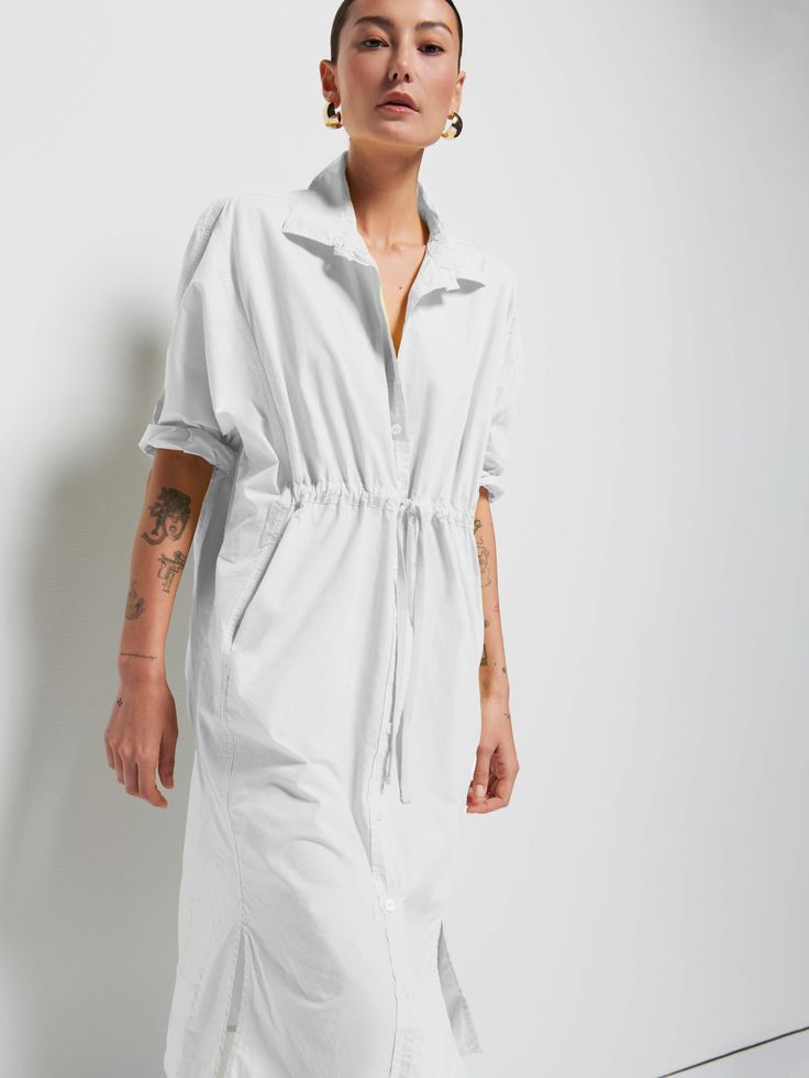 Because everyone needs an effortless shirt-dress, elevated with a shirred drawstring front and slits on the hem for a girly touch. Perfect for warm walks around the neighborhood and hiding from the heat at home after. (This one comes in Optic White.) | Irene Dress in Optic White | Ethical Essentials Spring Shirt Dress With Tie Waist And Relaxed Fit, Spring Relaxed Fit Shirt Dress With Tie Waist, Casual Ruched Shirt Dress For Daywear, Relaxed Fit Shirt Dress With Tie Waist For Daywear, Spring Dresses With Drawstring Tie For Daywear, Irene Dress, Nation Ltd, Dress Closet, Spring Summer Wardrobe