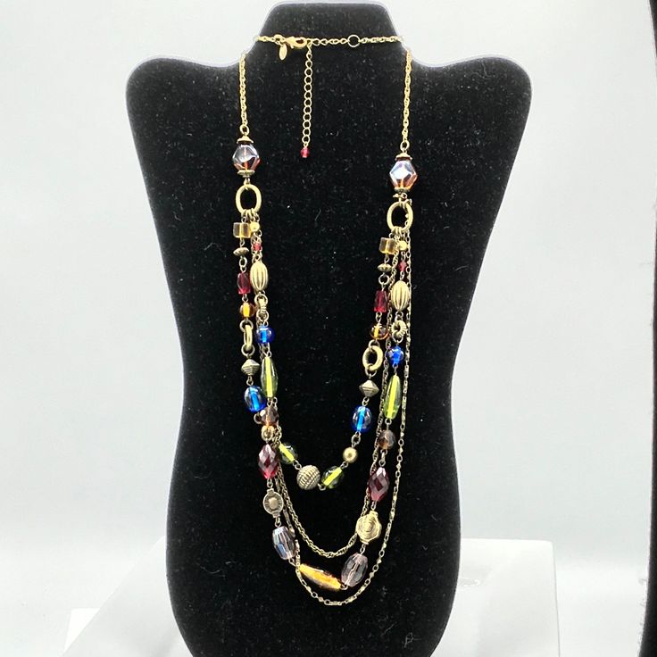 Brass tone with multicolored glass beads necklace by Lia Sophia. Czech Glass Double Strand Necklaces With Colorful Beads, Double Strand Czech Glass Necklace With Colorful Beads, Elegant Multicolor Glass Beaded Necklaces, Elegant Multicolor Glass Beaded Necklace, Multi-strand Czech Glass Colorful Beads Necklace, Multi-strand Czech Glass Necklaces With Colorful Beads, Multicolor Glass Necklaces With Faceted Beads, Colorful Glass Bead Necklaces For Parties, Colorful Multi-strand Czech Glass Bead Necklace