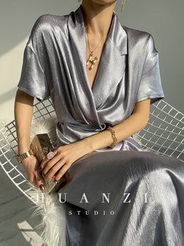 HUANZI custom designer high-end glossy silky elegant dress -Diana Pear – ORUMATORU Elegant Sheen Summer Dresses, Elegant Summer Dress With Sheen, Elegant Silk Midi Dress With Short Sleeves, Metallic Silk Dress For Evening, Chic Metallic Silk Dress, Luxury Satin V-neck Evening Dress, Luxury Satin Dress For Wedding, Elegant Summer Satin Dress For Formal Occasions, Metallic Silk Dresses