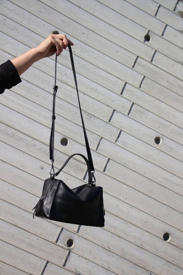 Mini Valley Cube Shoulder Bag-Black is simple and elegant, its spacious interior provides room for all the daily essentials and more, it is perfect for everyday use.This bag is made with premium full-grain Italian leather and lined with Micro Fiber, It has a full zipper closure, with an additional inner zipper pocket, it featuring an adjustable leather shoulder strap. This bag can be carried crossbody or on the shoulder.-Genuine Italian natural nappa leather-Lightweight-Long adjustable shoulder Everyday Leather Box Bag With Top Carry Handle, Modern Leather Shoulder Bag With Handle Drop, Sleek Shoulder Bag With Leather Top Handle, Sleek Top Handle Shoulder Bag With Leather Handles, Leather Box Bag With Handle Drop For Everyday Use, Black Leather Hobo Bag With Top Carry Handle, Modern Soft Leather Crossbody Satchel, Sleek Leather Shoulder Bag With Top Handle, Sleek Daily Bags With Leather Handles