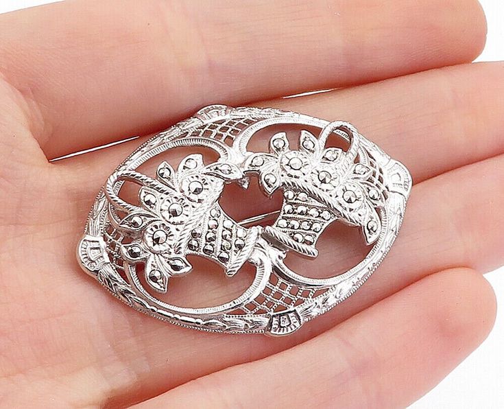 "925 Sterling Silver - Vintage Sparkling Double Flower Basket Brooch Pin - BP1752  925 Sterling Silver - Vintage Sparkling Double Flower Basket Brooch Pin - BP1752  Jewelry Type:         Brooch Pin   Metal Type:            925 Silver  Metal Size:             1.75\"  Stone Type:            N/A  Condition:              N/A  Jewelry Weight:     7.1 Grams  PLEASE NOTE: THIS ITEM IS PRE-OWNED. ALTHOUGH MOST ITEMS ARE IN VERY GOOD CONDITION, SOME MAY NEED CLEANING AND/OR MINOR REPAIRS. WE MAKE A VERY STRONG EFFORT TO UPLOAD CLEAR PICTURES. PLEASE INSPECT ALL PICTURES AND ASK ALL QUESTIONS YOU MAY HAVE PRIOR TO MAKING A PURCHASE. NOT ALL STONES ARE GENUINE, SOME ARE ENHANCED OR CREATED." Silver Art Deco Brooches For Wedding, Silver Art Deco Wedding Brooches, Silver Art Deco Wedding Brooch, Classic Silver Filigree Brooches, Classic Silver Brooches With Intricate Design, Silver Filigree Brooch For Anniversary, Intricate Design Brooches As Gifts, Silver Sterling Wedding Brooches, Elegant Silver Brooches Stamped 925