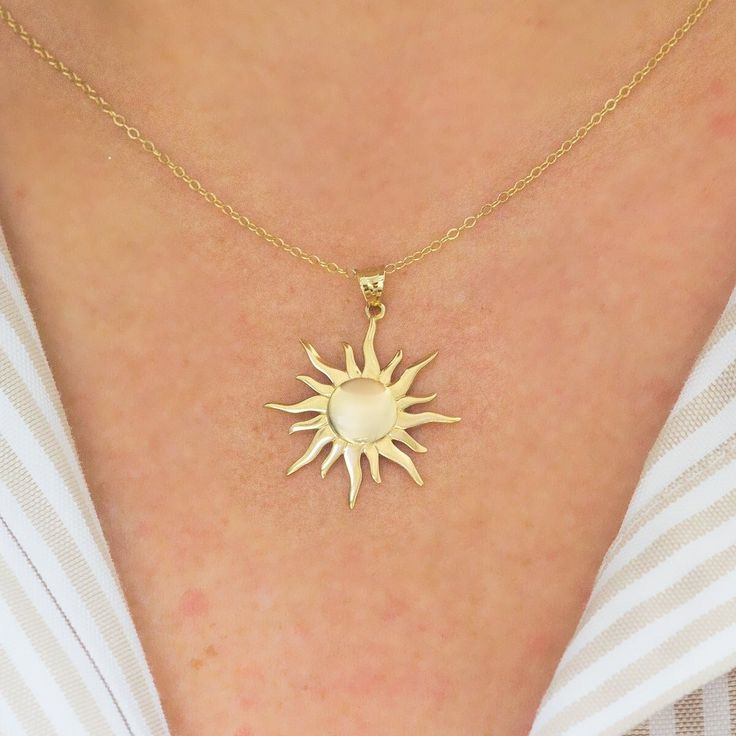 Burning sun figured, handmade 14 K yellow solid gold necklace. Comes with 14k gold chain. (Only pendant option) Standart chain length: 45 cm (17 inches) The size of sun is 22 mm (0,86 inches) diameter. Your lovely sun will arrive in a gift box. Choose your choice of chain lenght. Worldwide Shipping. (DHL/FEDEX/UPS/TNT) Please contact to me for any request. Immerse yourself in the radiant allure of the sun, a celestial orb that has captivated humanity since the dawn of time. Adorn yourself with a Sun-shaped Jewelry With Sun And Moon Design For Gift, 14k Gold Necklaces With Sun Design, Sun And Moon Design Necklace As A Gift, 14k Gold Sun Design Necklaces, 14k Gold Sun Design Jewelry Gift, 14k Gold Sun Design Necklace, 14k Yellow Gold Sun Design Necklace, Sterling Silver Necklace With Yellow Gold Sun Design, Yellow Gold Sun Design Necklace