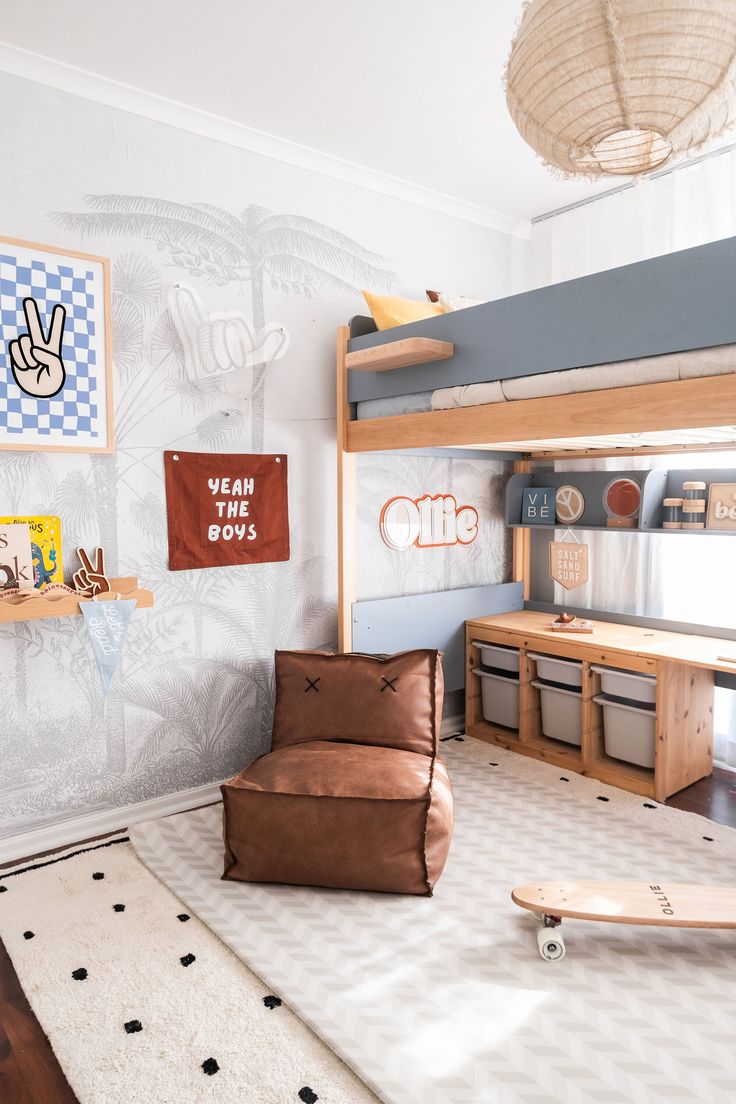 a child's bedroom with a bunk bed, chair and desk in the corner