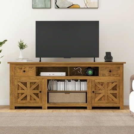 an entertainment center with a flat screen tv mounted on it's side, in a living room