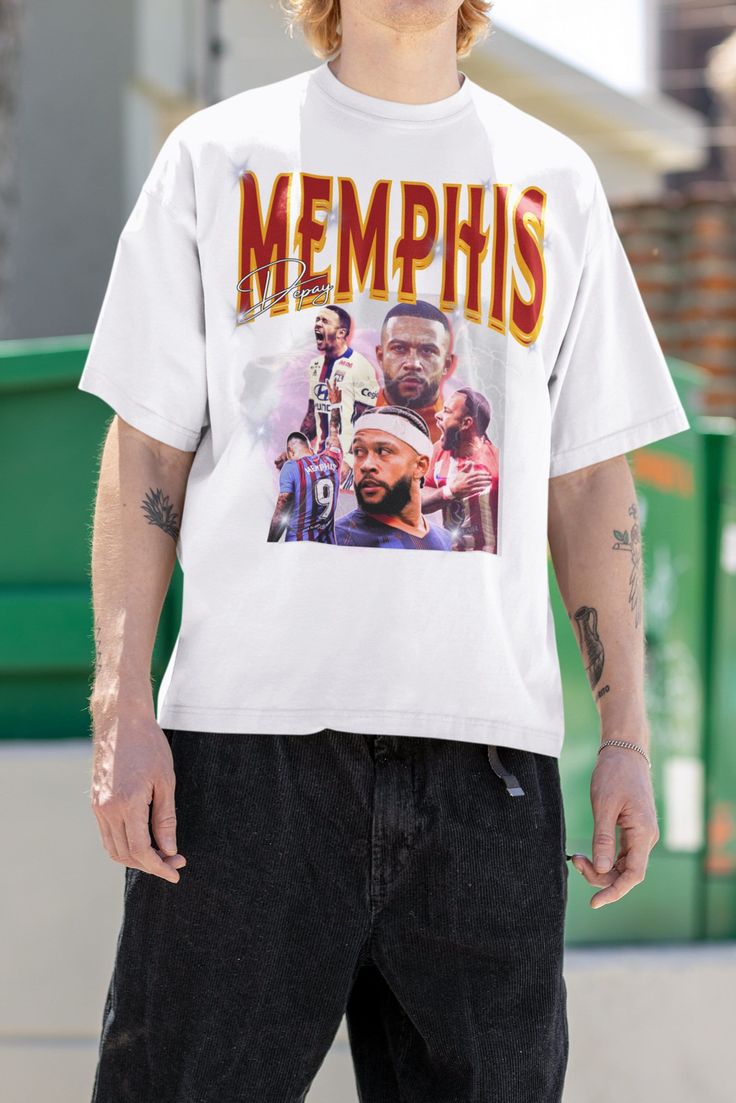 a man wearing a t - shirt that says memphis on it