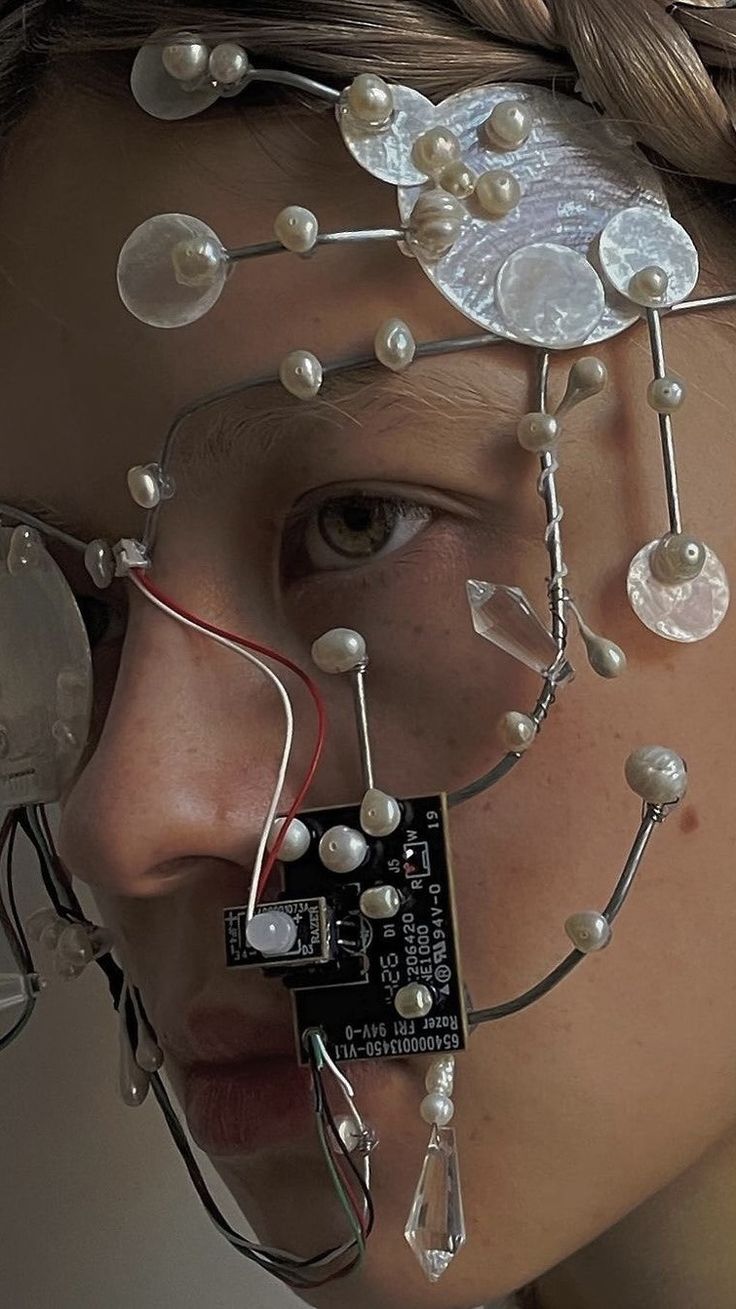 a woman with wires attached to her face