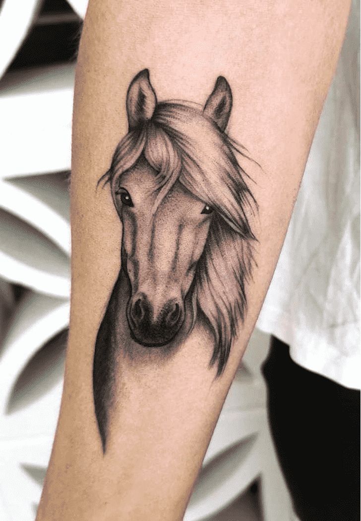 a horse's head is shown on the arm, with long manes and eyes