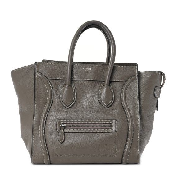 This is an authentic CELINE Drummed Calfskin Mini Luggage in Souris. This sophisticated travel tote is crafted of luxurious pebbled calfskin leather in taupe brown. The bag features rolled leather top handles, expandable sides, a frontal zipper pocket and decorative leather trim. The top zipper opens to a suede interior with zipper and patch pockets. Taupe Travel Bag With Palladium Hardware, Luxury Taupe Textured Leather Bag, Textured Leather Travel Bags In Taupe, Taupe Textured Leather Travel Bag, Classic Taupe Calf Leather Bag, Taupe Leather Bag With Smooth Grain, Classic Taupe Bag With Leather Lining, Classic Taupe Bags With Leather Lining, Luxury Soft Leather Bag In Taupe