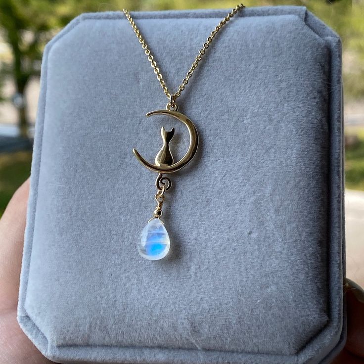 *Rainbow moonstone pendant size around 8mm *14k solid gold plated and white gold plated copper * 45cm or 55cm adjustable chain Refunds and Exchanges I gladly accept returns and exchanges Just contact me within: 3 days of delivery Ship items back to me within: 7 days of delivery Please contact me if you have any problems with your order. The following items can't be returned or exchanged * Custom or personalized orders * Items on sale Returns and exchange details Your satisfaction is guaranteed! Dainty Moonstone Clavicle Chain Necklace, Dainty Moonstone Charm Necklace For Gift, Dainty Moonstone Pendant Jewelry, Handmade Dainty Moonstone Necklace, Dainty Handmade Moonstone Necklace, Moonstone Dangle Jewelry With Moon Charm, Moonstone Teardrop Pendant Jewelry Gift, Handmade Moonstone Dangle Necklace, Moon Charm Teardrop Pendant Jewelry As Gift