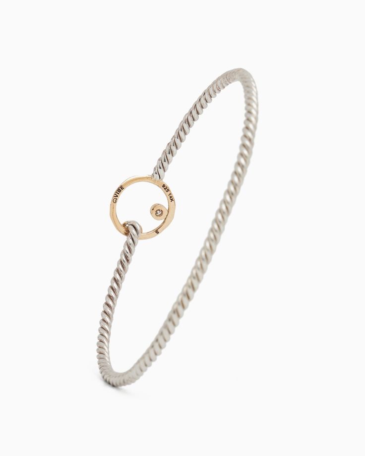 The One Love Twisted Hook Bracelet, gently hammered in sterling silver, features a twisted band, a 14K gold infinite circle and petroglyph, and a faceted diamond. Inspired by the boundless nature of love, this bracelet captures the spirit of the Caribbean, known for its friendly culture and warm embrace. Metal: Sterling silver with 14K gold accents Band Width: 2.5mm Circle Size: 12.5mm Stone Size: 2mm Style #: H96D Modern Twist Yellow Gold Jewelry With Single Diamond, Modern Twist Sterling Silver Tarnish-resistant Jewelry, Modern Twist Sterling Silver Bangle, Modern Twist Sterling Silver Promise Jewelry, Silver 14k Gold Bracelet With Single Diamond, Modern Twist Diamond Cut Round Jewelry, Modern Twist Diamond Cut Jewelry, Modern Twist 14k White Gold Jewelry, Hammered Timeless Jewelry For Anniversary