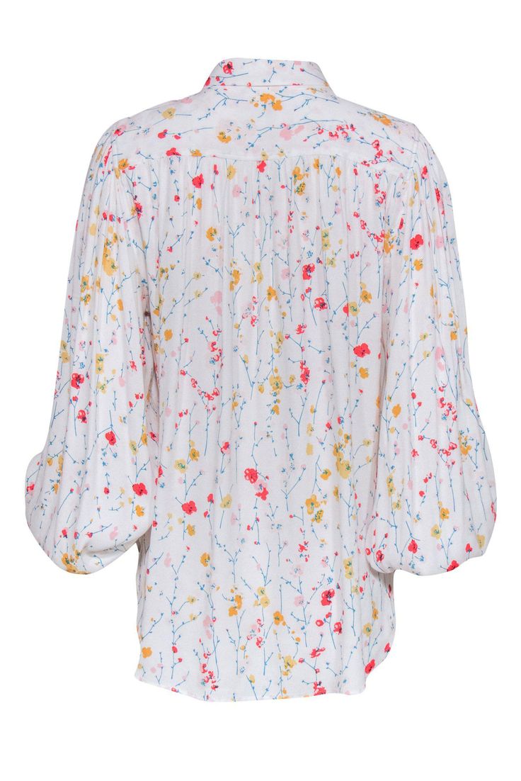 If you love flowers and a good pop of color, then you will love this long-sleeved blouse by Equipment! This dainty and organic print features puff sleeves and is very lightweight. Get your friends together and go to the flower show! Style this blouse by pairing with skinny jeans and lace up booties. Size L 100% Rayon Unlined Button down closure Relaxed silhouette Collared neckline Long sleeved Bust 40" Waist 42" Shoulder to hem 27" Sleeve length 25" Spring Tops With Blouson Sleeves, Spring Daywear Tops With Blouson Sleeves, Spring Bishop Sleeve Tops For Daywear, Multicolor Tops With Gathered Balloon Sleeves, Multicolor Tops With Balloon Gathered Sleeves, Multicolor Balloon Sleeve Blouse For Spring, Daywear Floral Print Blouse With Bishop Sleeves, Spring Daywear Blouse With Bishop Sleeves, Multicolor Top With Gathered Balloon Sleeves