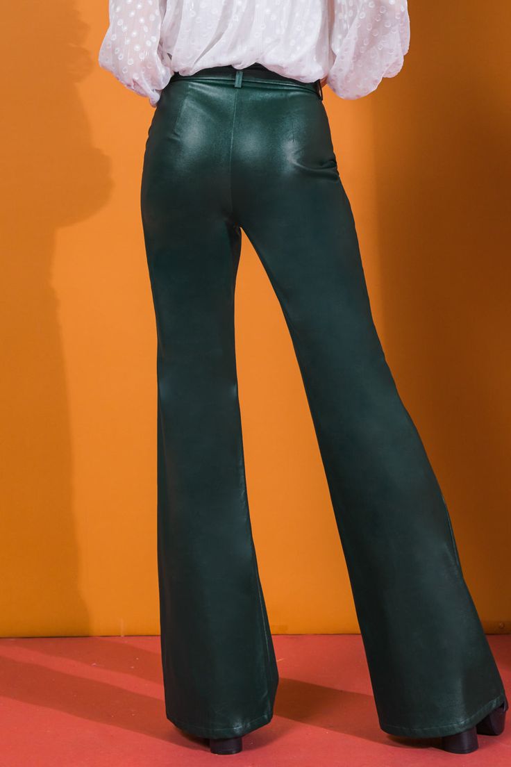 A faux leather pant featuring flare leg with center seam and self belt Details Self: Coating: 100% Polyurethane Ground: 100% Polyester Size & Fit - Model is 5`8" And Wearing Size Small - Measurements Taken From Size Small - Approx. Length: 45" Trendy Faux Leather Wide-leg Pants, Trendy Wide-leg Faux Leather Pants, Chic Flare Leather Pants, Chic Flared Leather Pants, Trendy Wide Leg Faux Leather Bottoms, Fitted Flare Leather Pants For Party, Flare Leather Pants For Night Out, Flared Leather Pants For Night Out, Stretch Leather Wide Leg Pants