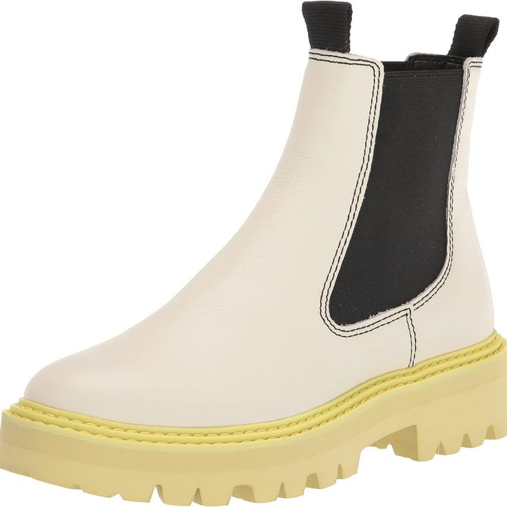 Dolce Vita Moana H2o Rain Boots White Leather With Contrasting Black And Dayglo Soft Rubber Sole Pullon Style Waterproof Bootie With Fun Colors That Brings A Little Happiness To Gray Days! Looks Great With Pair Of Jeans Or Even A Skirt. Have Fun! Nwt- No Box 9.5 Heel Height- 1.5" Shaft Height- 5" Boots White, Rain Boot, Dolce Vita Shoes, Moana, Soft Rubber, Green Leather, White Green, White Leather, Bootie