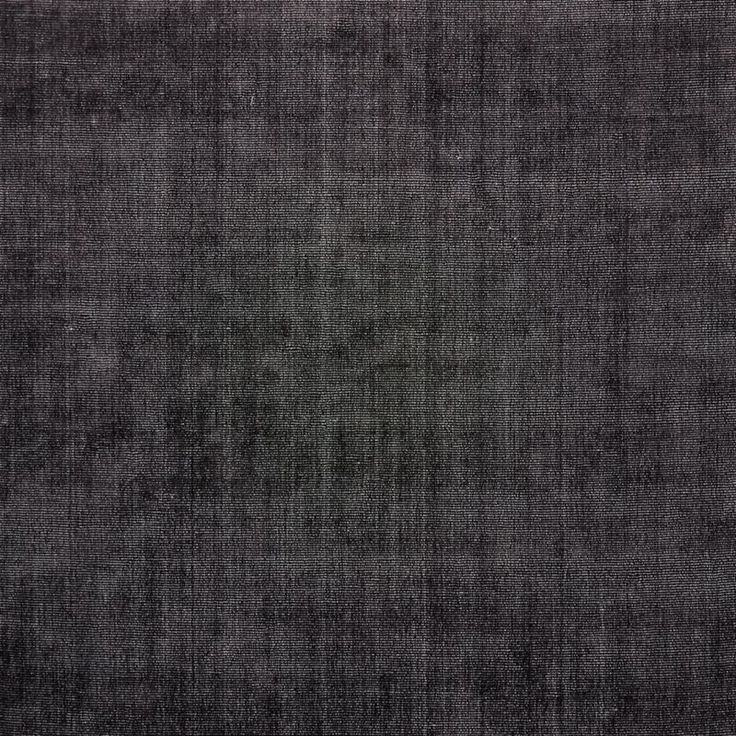 an area rug with dark gray colors