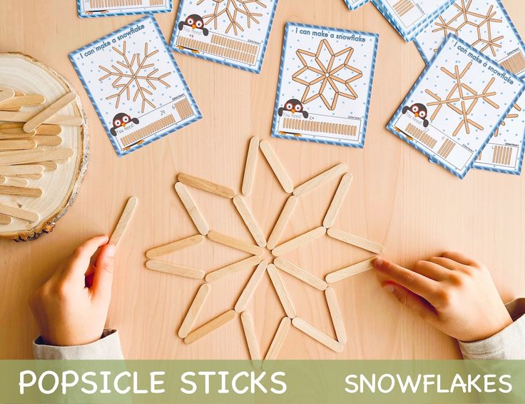 the popsicle sticks snowflakes are being made