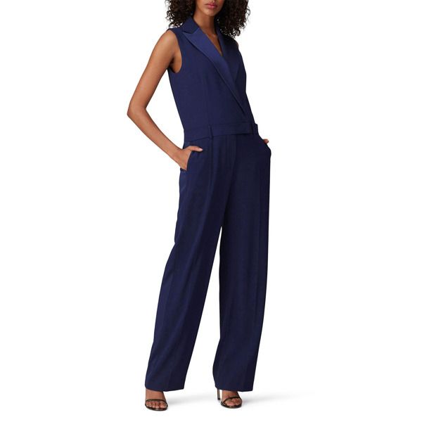 Navy crinkle chiffon (100% Polyester). Jumpsuit. Sleeveless. Shirt collar neckline. Exposed center back zipper with hook-and-eye closure. Fully lined. Inseam: 33". Leg Opening: 25". 58" from shoulder to hemline. Imported. Sleeveless Blue Pantsuit For Summer, Sleeveless Solid Color Workwear Pantsuit, Solid Sleeveless Pantsuit For Work, Tailored Sleeveless Spring Pantsuit, Elegant Tailored Sleeveless Jumpsuits And Rompers, Sleeveless Formal Summer Pantsuit, Sleeveless Summer Formal Pantsuit, Sleeveless Pantsuit For Formal Summer Events, Sleeveless Summer Pantsuit For Formal Occasions