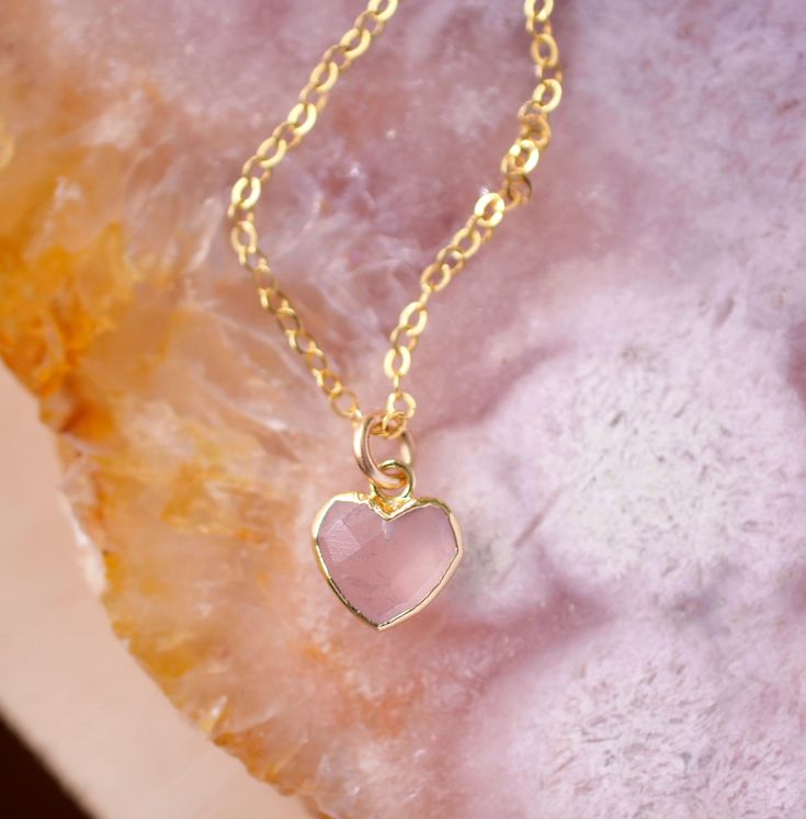 Looking for a unique accessory for some self love, or love for that special someone? Crafted from 14k gold filled and natural Rose Quartz, this pendant is the perfect, sparkling way to show anyone how much you care. Rose Quartz is a stone of love. It is believed to restore trust & harmony in relationships and encourage unconditional love. It purifies the heart and promotes self love, inner healing, and friendship. It is an alternate birthstone for January, as well as the spiritual birthstone for 14k Gold Heart Necklace With Gemstone For Gift, Handmade Rose Gold Heart Pendant Jewelry, Dainty Birthstone Jewelry For Valentine's Day, 14k Gold Gemstone Heart Necklace For Valentine's Day, Delicate Pink Gold Jewelry With Gemstone, Dainty Rose Gold Jewelry With Heart Charm, Rose Gold Jewelry With Rose Quartz For Gift, Dainty Rose Quartz Pendant Jewelry, Rose Gold Rose Quartz Jewelry Gift