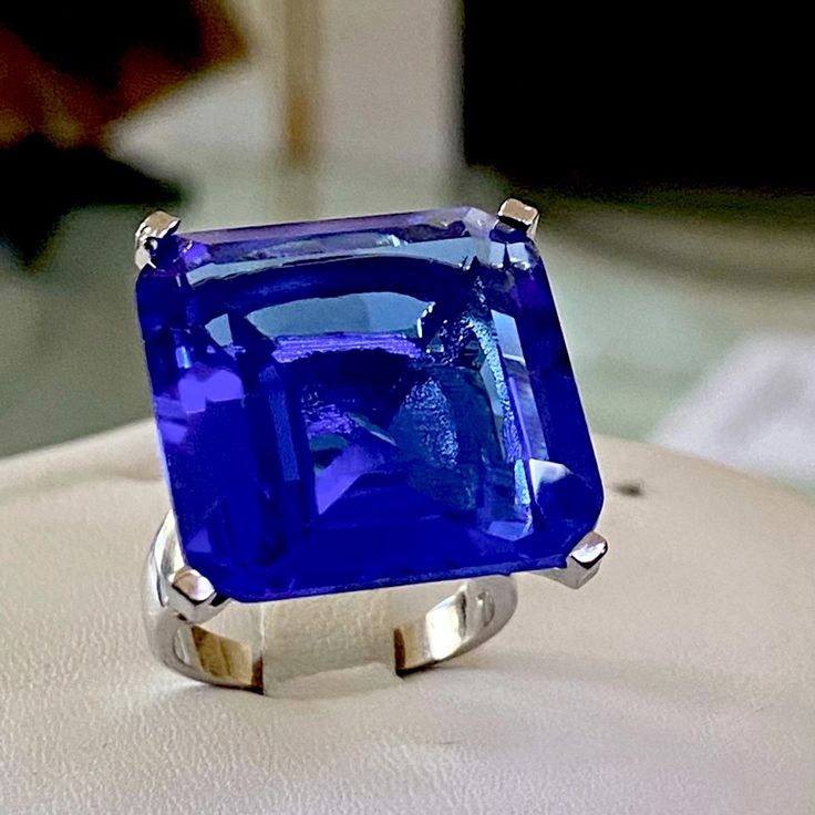 Fabulous 22x22mm Of Princess Cut Violet Tanzanite Cz Set In Sterling Silver Ring . Pictures Are Taken In Different Lightings To Capture The Magnificent Color Of This Gem Comes In An Elegant Gift Box And A Silk Pouch . Formal Blue Polished Gemstones, Formal Blue Tanzanite Gemstones, Blue Gemstone Rings For Evening, Elegant Blue Tanzanite Gemstones, Elegant Blue Gemstones With Polished Finish, Silver Sapphire Ring For Party, Dazzling Blue Gemstones As Gift, Dazzling Blue Gemstones For Gift, Dazzling Blue Gemstones For Gifts