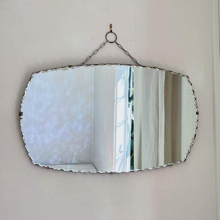 a mirror that is hanging on the wall