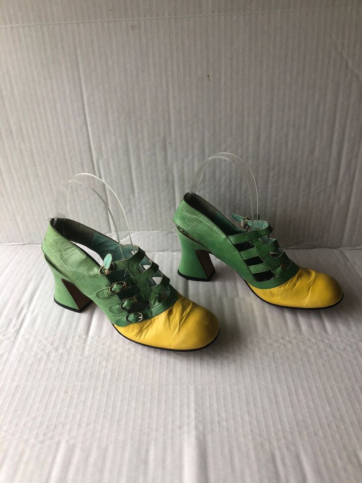 "sz 8 length 10.5\" insole 10\"width 3\" heel height 3\" vintage 1960s boho fun shoes  green and yellow buckle up shoes 4 straps and buckles round  square toe high Cuban heel leather sole and lining unique style DON VICENTE label good condition sustainable fashion made in the SPAIN" Retro Heels With Buckle Closure And Square Toe, Retro Heels With Buckle Closure And Round Toe, Retro Round Toe Heels With Buckle Closure, Retro Square Toe Heels With Buckle Closure, Retro Green Closed Toe Heels, Vintage Yellow Pointed Toe Heels, Green Retro Closed Toe Heels, Green Block Heel Shoes With Buckle Closure, Green Block Heels With Buckle Closure