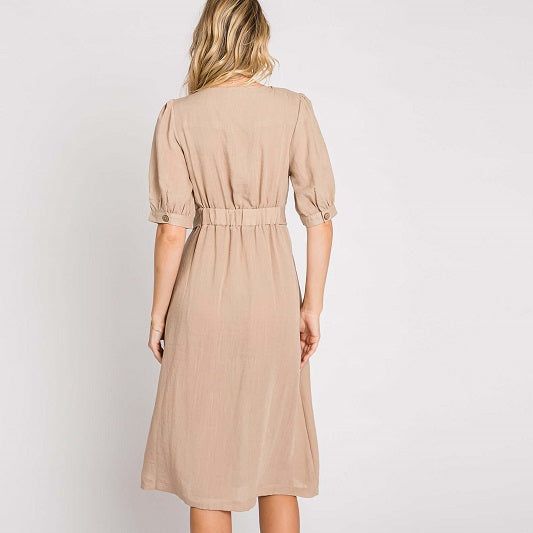 Elevate your wardrobe with our Asymmetrical Button-Down Wrapped Midi Dress, a true embodiment of timeless elegance and style. This dress offers a perfect blend of sophistication and modern flair, ensuring you'll look effortlessly chic and feel confident on any occasion. Key Features: Half-Sleeve Design: The dress features a half-sleeve with button closure, providing a touch of modesty and versatility. You can adjust the sleeves to your preference, making it suitable for various weather condition Fitted V-neck Midi Dress With Button Cuffs, Elegant Dresses With Button Closure, Classic V-neck Midi Dress With Buttons, Fitted Knee-length Shirt Dress In Solid Color, Spring Elegant Midi Dress With Buttons, Elegant Spring Midi Dress With Buttons, Fitted Knee-length Shirt Dress, Fitted Knee-length Solid Color Shirt Dress, Feminine Formal Midi Dress With Buttons