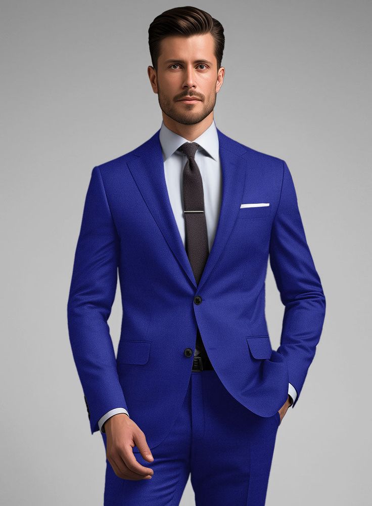 Explore a whole new world of fashion and define your presence in our immaculate Scabal Cobalt Blue Wool Suit. Crafted from pure wool, this blue suit gives off a sense of not only style but also professionalism and competency, earning you an added level of respect. The cobalt blue color will make you feel confident about yourself. Simply team it up with a white formal shirt, printed tie, and polished black shoes to complete this eye-catching look.   Look Includes   Scabal Cobalt Blue Wool Fabric  Two Button Jacket Style  Notch Lapel  Horn Royal Black Buttons  Single Vent  Three Cuff Buttons  Two Welted Back Pockets on Trousers    Click 'Customize Now' to modify the look if needed.   Lining: 100% Viscose, Dry Clean. Fitted Blue Suit In Suiting Fabric, Blue Fitted Suit In Suiting Fabric, Blue Slim Fit Suits With Welt Pockets, Slim Fit Blue Suits For Workwear, Slim Fit Blue Suit For Work, Royal Blue Notch Lapel Suits For Work, Blue Slim Fit Suit In Suiting Fabric, Blue Slim Fit Suits In Suiting Fabric, Blue Three-piece Suit With Welt Pockets For Business Casual