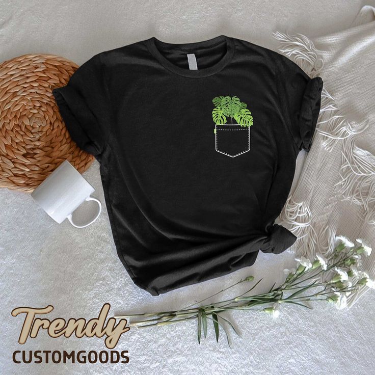 "Monstera Pocket Shirt,Plant Lady TShirt,Plant Lover Gift,Plant Mom Tee,Nature Lover Shirt,Botanical Shirt,Gardening Shirt,Monstera Leaves ----- How To Order ----- 1-) Please, check and review all the photos. 2-) Choose your t-shirt size and color. *Different styles of shirts may have different shades of same color choice due to different manufacturer brands. *For this reason, we recommend you to match shirts from the same styles if you want precisely matching colors (ex. Unisex, V-necks, Toddle Relaxed Fit Green T-shirt With Plant Print, Green T-shirt With Pockets In Relaxed Fit, Green Relaxed Fit T-shirt With Pockets, Green Pocket T-shirt For Spring, Green T-shirt With Plants Print, Relaxed Fit, Green Spring T-shirt With Pockets, Cotton T-shirt With Plant Detail, Short Sleeve, Green T-shirt With Pockets For Spring, Green Cotton T-shirt With Plant Print